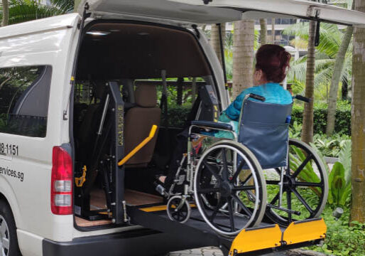 wheelchair transport wheelchair user lifted on hydraulic lift